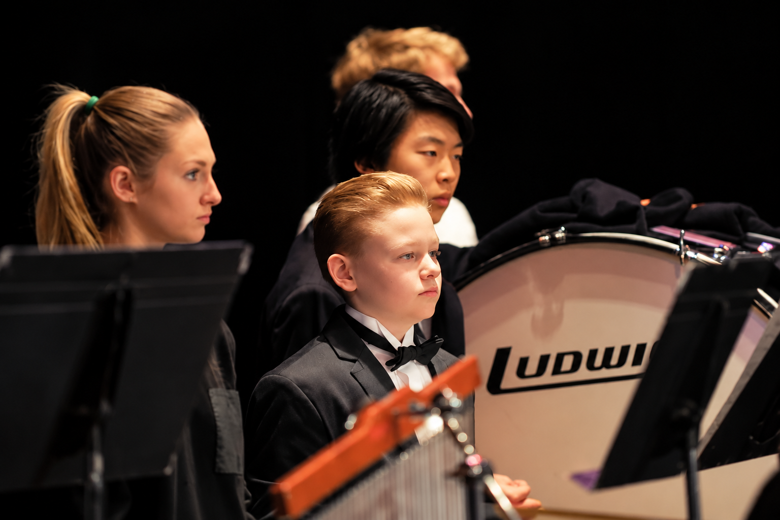 Junior orchestra students performing together