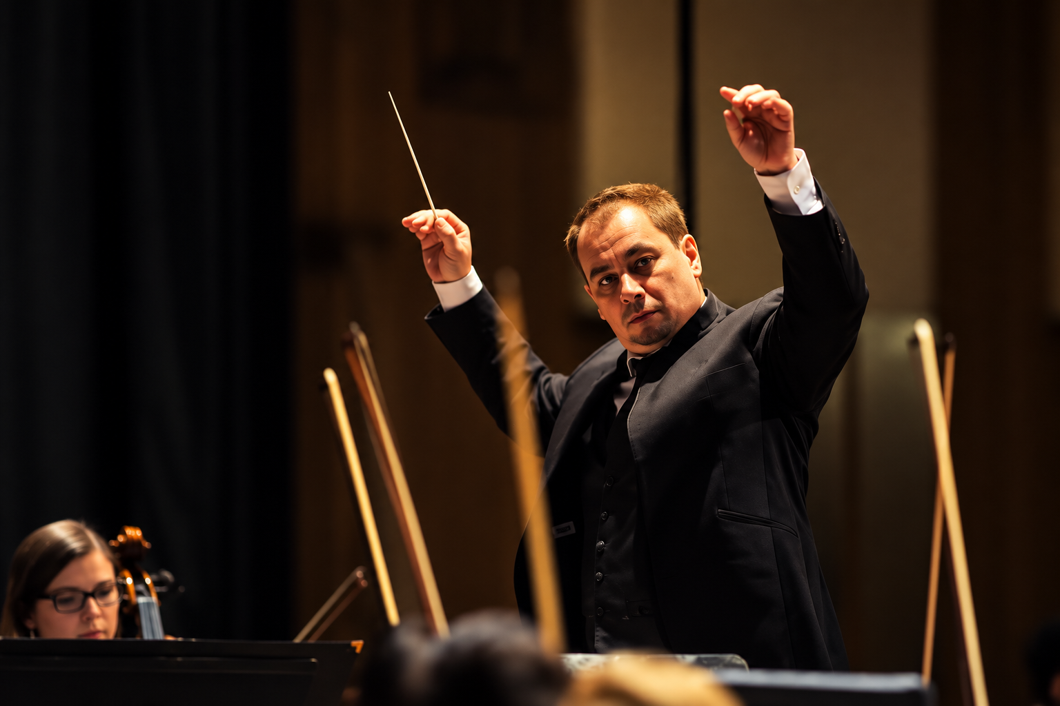 CYSO musicians and conductor in rehearsal